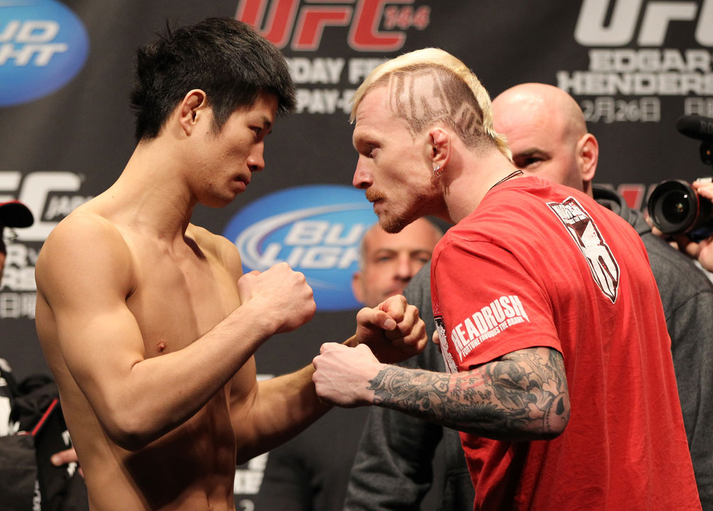SAITAMA, JAPAN - FEBRUARY 25: (L-R) Opponents Hatsu Hioki and Bart Palaszewski face off after weighing in during the official UFC 144 weigh in at the Saitama Super Arena on February 25, 2012 in Saitama, Japan. (Photo by Josh Hedges/Zuffa LLC/Zuffa LLC via Getty Images) *** Local Caption *** Hatsu Hioki; Bart Palaszewski