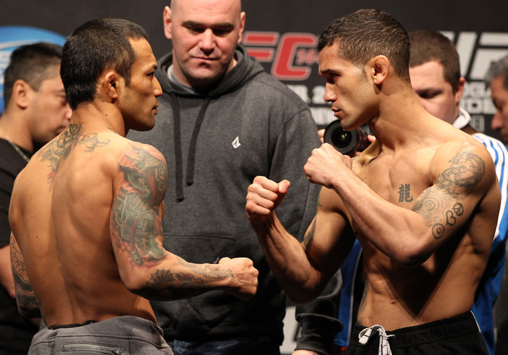 SAITAMA, JAPAN - FEBRUARY 25: (L-R) Bantamweight opponents Norifumi "Kid" Yamamoto and Vaughn Lee face off after weighing in during the official UFC 144 weigh in at the Saitama Super Arena on February 25, 2012 in Saitama, Japan. (Photo by Josh Hedges/Zuffa LLC/Zuffa LLC via Getty Images) *** Local Caption *** Norifumi Yamamoto; Vaughn Lee