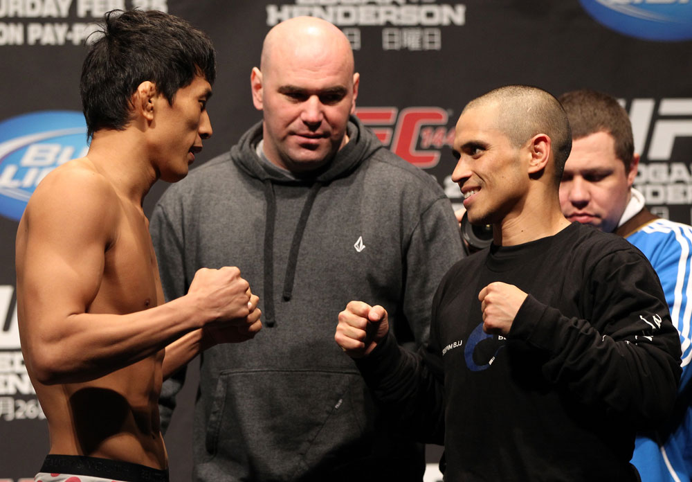 SAITAMA, JAPAN - FEBRUARY 25: (L-R) Opponents Takeya Mizugaki and Chris Cariaso face off after weighing in during the official UFC 144 weigh in at the Saitama Super Arena on February 25, 2012 in Saitama, Japan. (Photo by Josh Hedges/Zuffa LLC/Zuffa LLC via Getty Images) *** Local Caption *** Takeya Mizugaki; Chris Cariaso; Dana White