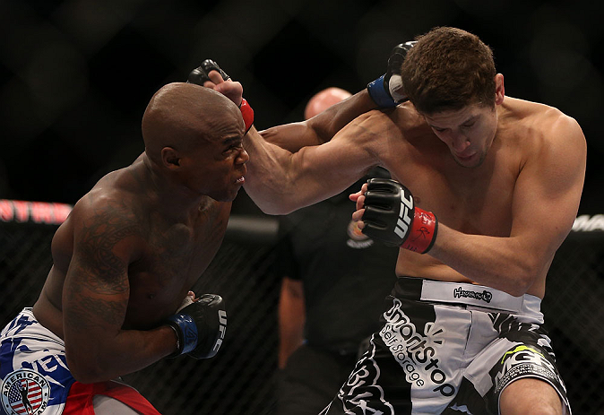 TORONTO, CANADA - SEPTEMBER 22: (L-R) Marcus Brimage punches Jimy Hettes during their featherweight bout at UFC 152 inside Air Canada Centre on September 22, 2012 in Toronto, Ontario, Canada. (Photo by Josh Hedges/Zuffa LLC/Zuffa LLC via Getty Images)