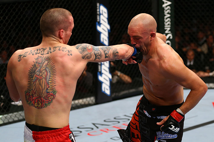 TORONTO, CANADA - SEPTEMBER 22: (L-R) Lance Benoist punches Sean Pierson during their welterweight bout at UFC 152 inside Air Canada Centre on September 22, 2012 in Toronto, Ontario, Canada. (Photo by Al Bello/Zuffa LLC/Zuffa LLC via Getty Images)