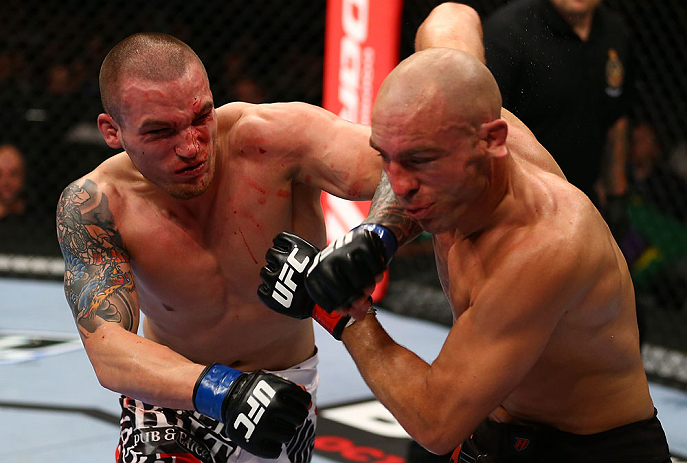 TORONTO, CANADA - SEPTEMBER 22: (L-R) Lance Benoist punches Sean Pierson during their welterweight bout at UFC 152 inside Air Canada Centre on September 22, 2012 in Toronto, Ontario, Canada. (Photo by Al Bello/Zuffa LLC/Zuffa LLC via Getty Images)