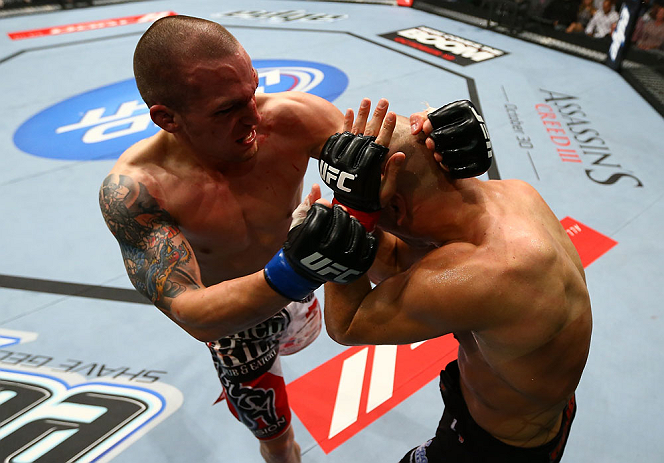 TORONTO, CANADA - SEPTEMBER 22: (L-R) Lance Benoist punches Sean Pierson during their welterweight bout at UFC 152 inside Air Canada Centre on September 22, 2012 in Toronto, Ontario, Canada. (Photo by Al Bello/Zuffa LLC/Zuffa LLC via Getty Images)