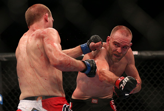 TORONTO, CANADA - SEPTEMBER 22: (R-L) T.J. Grant punches Evan Dunham during their lightweight bout at UFC 152 inside Air Canada Centre on September 22, 2012 in Toronto, Ontario, Canada. (Photo by Josh Hedges/Zuffa LLC/Zuffa LLC via Getty Images)