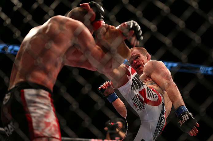 TORONTO, CANADA - SEPTEMBER 22: (R-L) Evan Dunham kicks T.J. Grant during their lightweight bout at UFC 152 inside Air Canada Centre on September 22, 2012 in Toronto, Ontario, Canada. (Photo by Josh Hedges/Zuffa LLC/Zuffa LLC via Getty Images)