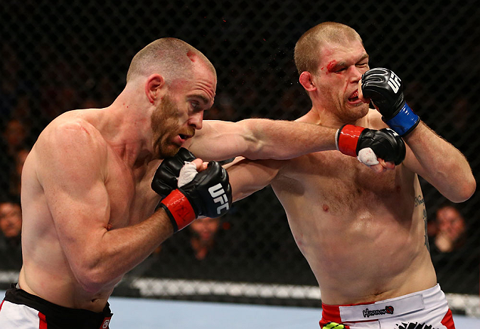 TORONTO, CANADA - SEPTEMBER 22: (L-R) T.J. Grant and Evan Dunham trade punches during their lightweight bout at UFC 152 inside Air Canada Centre on September 22, 2012 in Toronto, Ontario, Canada. (Photo by Al Bello/Zuffa LLC/Zuffa LLC via Getty Images)