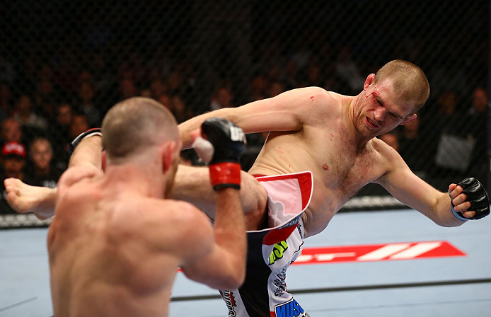 TORONTO, CANADA - SEPTEMBER 22: (R-L) Evan Dunham kicks T.J. Grant during their lightweight bout at UFC 152 inside Air Canada Centre on September 22, 2012 in Toronto, Ontario, Canada. (Photo by Al Bello/Zuffa LLC/Zuffa LLC via Getty Images)