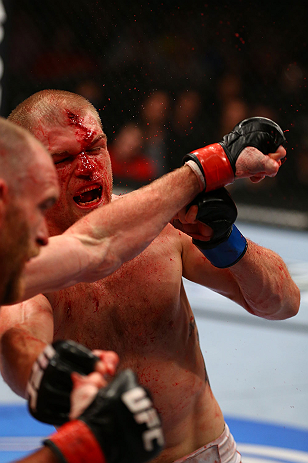 TORONTO, CANADA - SEPTEMBER 22: (R-L) Evan Dunham and T.J. Grant trade punches during their lightweight bout at UFC 152 inside Air Canada Centre on September 22, 2012 in Toronto, Ontario, Canada. (Photo by Al Bello/Zuffa LLC/Zuffa LLC via Getty Images)