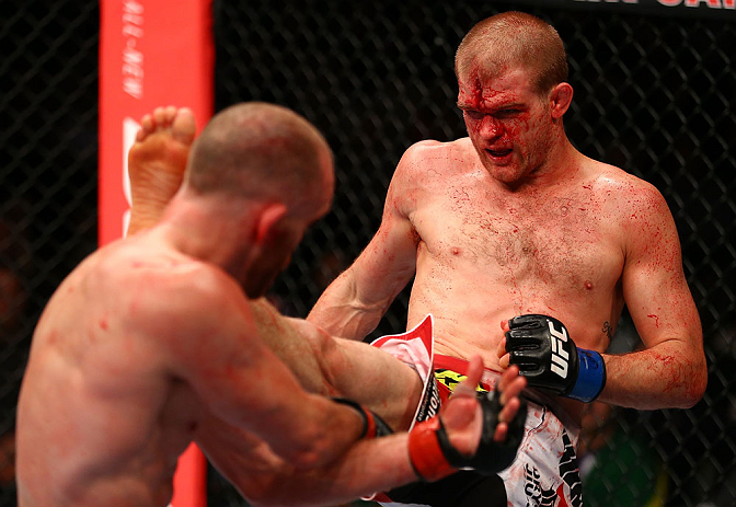 TORONTO, CANADA - SEPTEMBER 22: (R-L) Evan Dunham kicks T.J. Grant during their lightweight bout at UFC 152 inside Air Canada Centre on September 22, 2012 in Toronto, Ontario, Canada. (Photo by Al Bello/Zuffa LLC/Zuffa LLC via Getty Images)