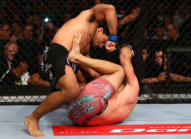 TORONTO, CANADA - SEPTEMBER 22: (L-R) Vinny Magalhaes punches Igor Pokrajac during their light heavyweight bout at UFC 152 inside Air Canada Centre on September 22, 2012 in Toronto, Ontario, Canada. (Photo by Al Bello/Zuffa LLC/Zuffa LLC via Getty Images)