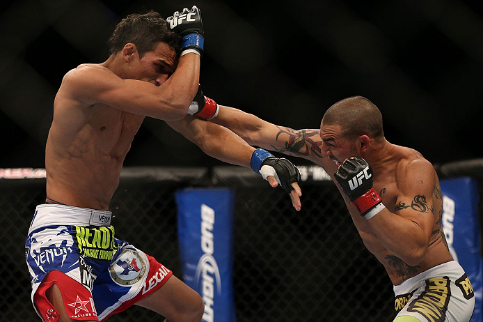 TORONTO, CANADA - SEPTEMBER 22: (R-L) Cub Swanson punches Charles Oliveira during their featherweight bout at UFC 152 inside Air Canada Centre on September 22, 2012 in Toronto, Ontario, Canada. (Photo by Josh Hedges/Zuffa LLC/Zuffa LLC via Getty Images)