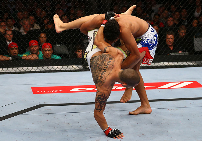 TORONTO, CANADA - SEPTEMBER 22:    (R-L) Charles Oliveira takes down Cub Swanson during their featherweight bout at UFC 152 inside Air Canada Centre on September 22, 2012 in Toronto, Ontario, Canada.  (Photo by Al Bello/Zuffa LLC/Zuffa LLC via Getty Images)