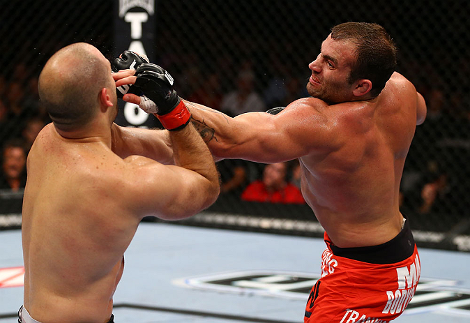 TORONTO, CANADA - SEPTEMBER 22: (R-L) Roger Hollett punches Matt Hamill during their light heavyweight bout at UFC 152 inside Air Canada Centre on September 22, 2012 in Toronto, Ontario, Canada. (Photo by Al Bello/Zuffa LLC/Zuffa LLC via Getty Images)