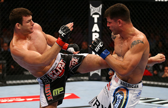 TORONTO, CANADA - SEPTEMBER 22: (L-R) Michael Bisping kicks Brian Stann during their middleweight bout at UFC 152 inside Air Canada Centre on September 22, 2012 in Toronto, Ontario, Canada. (Photo by Al Bello/Zuffa LLC/Zuffa LLC via Getty Images)