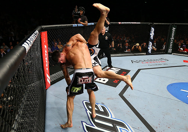 TORONTO, CANADA - SEPTEMBER 22: (L-R) Michael Bisping takes down Brian Stann during their middleweight bout at UFC 152 inside Air Canada Centre on September 22, 2012 in Toronto, Ontario, Canada. (Photo by Al Bello/Zuffa LLC/Zuffa LLC via Getty Images)