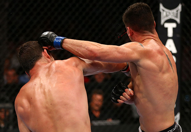 TORONTO, CANADA - SEPTEMBER 22: (L-R) Michael Bisping punches Brian Stann during their middleweight bout at UFC 152 inside Air Canada Centre on September 22, 2012 in Toronto, Ontario, Canada. (Photo by Al Bello/Zuffa LLC/Zuffa LLC via Getty Images)