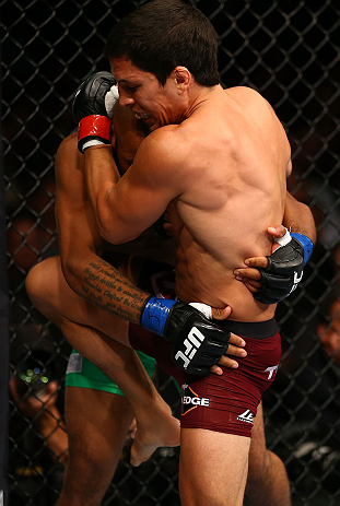 TORONTO, CANADA - SEPTEMBER 22: (R-L) Joseph Benavidez delivers a knee against Demetrious Johnson during their flyweight championship bout at UFC 152 inside Air Canada Centre on September 22, 2012 in Toronto, Ontario, Canada. (Photo by Al Bello/Zuffa LLC/Zuffa LLC via Getty Images)
