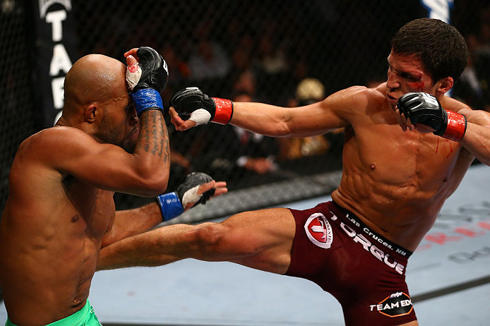 TORONTO, CANADA - SEPTEMBER 22: (R-L) Joseph Benavidez kicks Demetrious Johnson during their flyweight championship bout at UFC 152 inside Air Canada Centre on September 22, 2012 in Toronto, Ontario, Canada. (Photo by Al Bello/Zuffa LLC/Zuffa LLC via Getty Images)