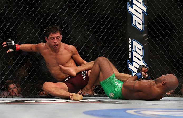 TORONTO, CANADA - SEPTEMBER 22:    (R-L) Demetrious Johnson attempts a leg lock submission against Joseph Benavidez during their flyweight championship bout at UFC 152 inside Air Canada Centre on September 22, 2012 in Toronto, Ontario, Canada.  (Photo by Josh Hedges/Zuffa LLC/Zuffa LLC via Getty Images)