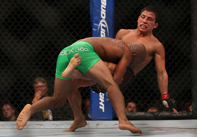 TORONTO, CANADA - SEPTEMBER 22:    (L-R) Demetrious Johnson takes down Joseph Benavidez during their flyweight championship bout at UFC 152 inside Air Canada Centre on September 22, 2012 in Toronto, Ontario, Canada.  (Photo by Josh Hedges/Zuffa LLC/Zuffa LLC via Getty Images)