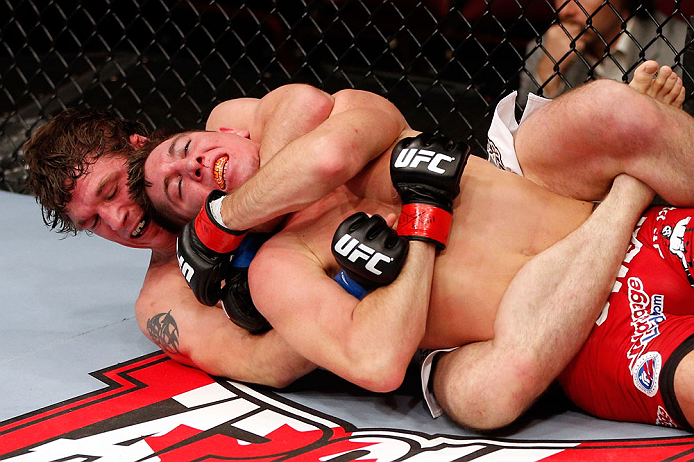 MONTREAL, QC - NOVEMBER 17:  Darren Elkins (white shorts) fights against Steven Siler in their featherweight bout during UFC 154 on November 17, 2012  at the Bell Centre in Montreal, Canada.  (Photo by Josh Hedges/Zuffa LLC/Zuffa LLC via Getty Images)
