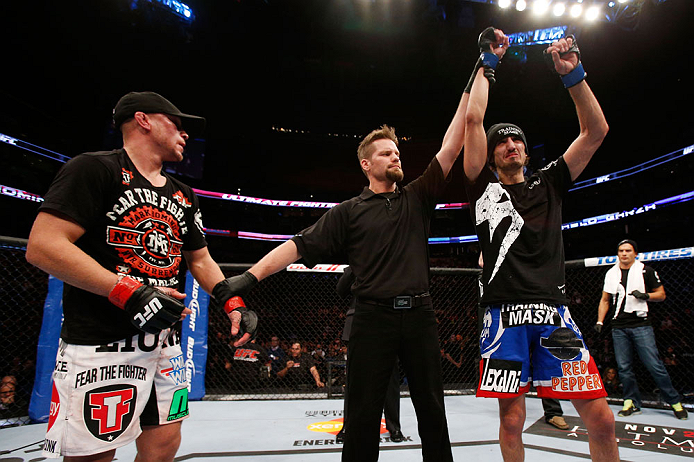MONTREAL, QC - NOVEMBER 17:  Pablo Garza (R)) celebrates after defeating Mark Hominick in their featherweight bout during UFC 154 on November 17, 2012  at the Bell Centre in Montreal, Canada.  (Photo by Josh Hedges/Zuffa LLC/Zuffa LLC via Getty Images)