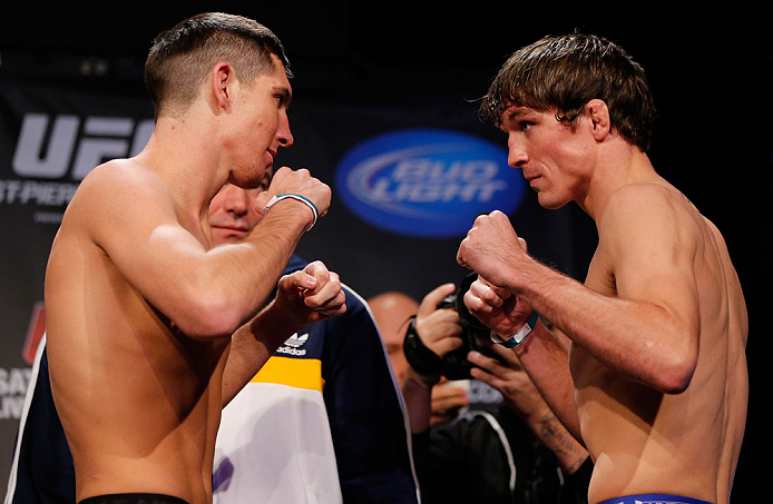 MONTREAL, CANADA - NOVEMBER 16:  (L-R) Opponents Steven Siler and Darren Elkins face off during the official UFC 154 weigh in at New City Gas on November 16, 2012 in Montreal, Quebec, Canada.  (Photo by Josh Hedges/Zuffa LLC/Zuffa LLC via Getty Images)