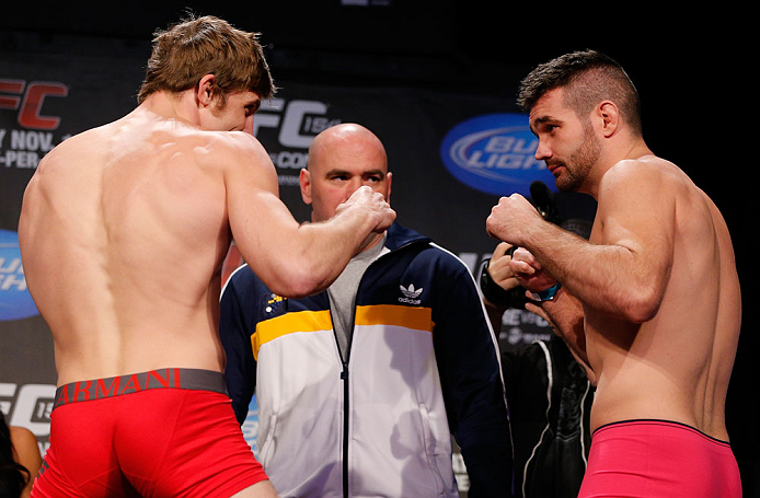 MONTREAL, CANADA - NOVEMBER 16:  (L-R) Opponents Matthew Riddle and John Maguire face off during the official UFC 154 weigh in at New City Gas on November 16, 2012 in Montreal, Quebec, Canada.  (Photo by Josh Hedges/Zuffa LLC/Zuffa LLC via Getty Images)