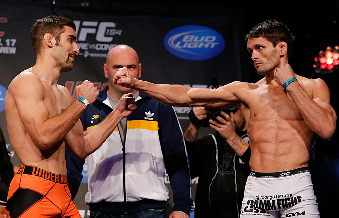 MONTREAL, CANADA - NOVEMBER 16:  (L-R) Opponents Antonio Carvalho and Rodrigo Damm face off during the official UFC 154 weigh in at New City Gas on November 16, 2012 in Montreal, Quebec, Canada.  (Photo by Josh Hedges/Zuffa LLC/Zuffa LLC via Getty Images)