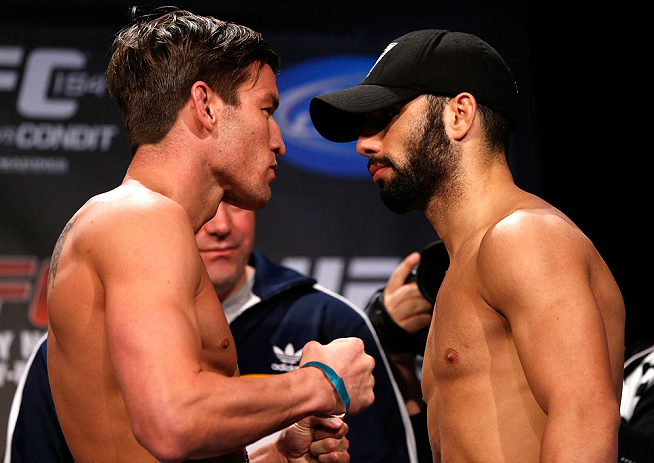 MONTREAL, CANADA - NOVEMBER 16:  (L-R) Opponents Sam Stout and John Makdessi face off during the official UFC 154 weigh in at New City Gas on November 16, 2012 in Montreal, Quebec, Canada.  (Photo by Josh Hedges/Zuffa LLC/Zuffa LLC via Getty Images)