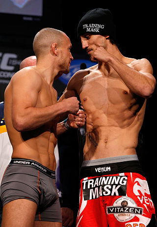 MONTREAL, CANADA - NOVEMBER 16:  (L-R) Opponents Mark Hominick and Pablo Garza face off during the official UFC 154 weigh in at New City Gas on November 16, 2012 in Montreal, Quebec, Canada.  (Photo by Josh Hedges/Zuffa LLC/Zuffa LLC via Getty Images)