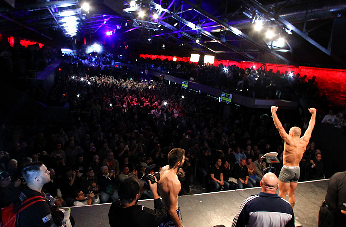 MONTREAL, CANADA - NOVEMBER 16: Georges St-Pierre (R) weighs in as opponent Carlos Condit looks on during the official UFC 154 weigh in at New City Gas on November 16, 2012 in Montreal, Quebec, Canada. (Photo by Josh Hedges/Zuffa LLC/Zuffa LLC via Getty Images)