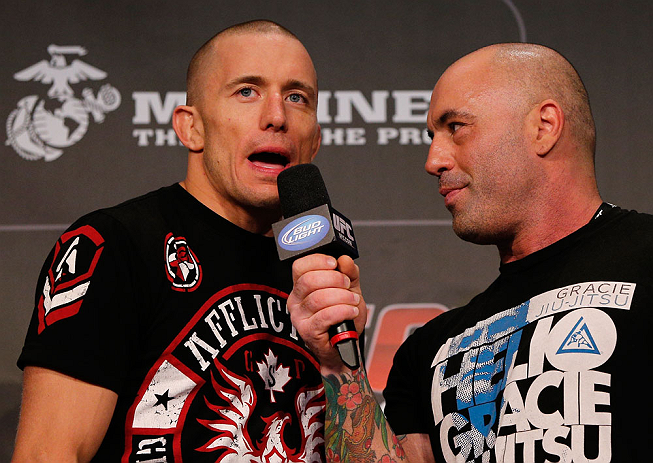 MONTREAL, CANADA - NOVEMBER 16: (R-L) Georges St-Pierre is interviewed by Joe Rogan after making weight during the official UFC 154 weigh in at New City Gas on November 16, 2012 in Montreal, Quebec, Canada. (Photo by Josh Hedges/Zuffa LLC/Zuffa LLC via Getty Images)