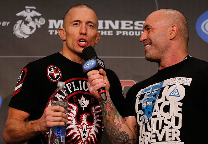 MONTREAL, CANADA - NOVEMBER 16: (R-L) Georges St-Pierre is interviewed by Joe Rogan after making weight during the official UFC 154 weigh in at New City Gas on November 16, 2012 in Montreal, Quebec, Canada. (Photo by Josh Hedges/Zuffa LLC/Zuffa LLC via Getty Images)