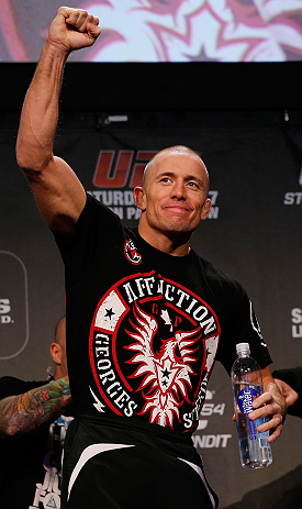 MONTREAL, CANADA - NOVEMBER 16: Georges St-Pierre salutes the fans during the official UFC 154 weigh in at New City Gas on November 16, 2012 in Montreal, Quebec, Canada. (Photo by Josh Hedges/Zuffa LLC/Zuffa LLC via Getty Images)