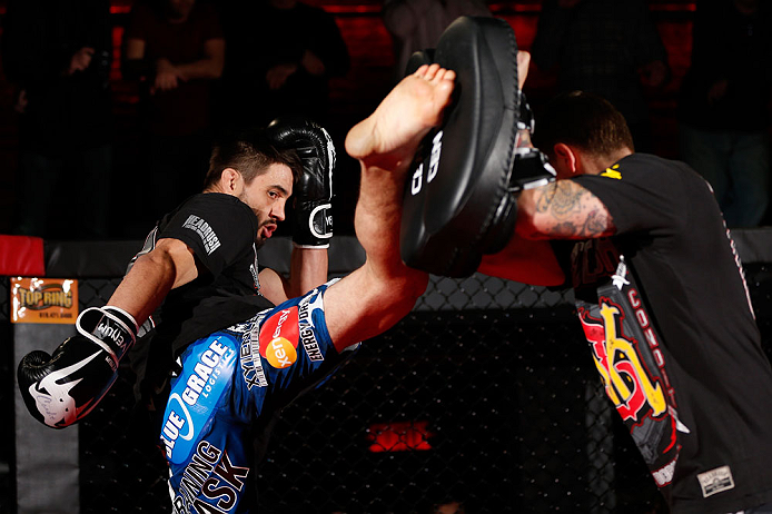 MONTREAL, CANADA - NOVEMBER 15:  Carlos Condit works out for media and fans during an open training session ahead of UFC 154 at New City Gas on November 15, 2012 in Montreal, Quebec, Canada.  (Photo by Josh Hedges/Zuffa LLC/Zuffa LLC via Getty Images)