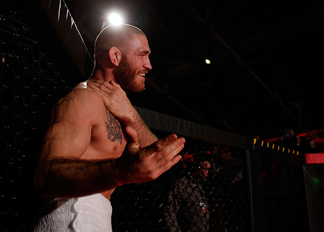 MONTREAL, CANADA - NOVEMBER 15:  Tom Lawlor performs a sumo workout routine for media and fans during an open training session ahead of UFC 154 at New City Gas on November 15, 2012 in Montreal, Quebec, Canada.  (Photo by Josh Hedges/Zuffa LLC/Zuffa LLC via Getty Images)