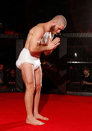 MONTREAL, CANADA - NOVEMBER 15:  Tom Lawlor performs a sumo workout routine for media and fans during an open training session ahead of UFC 154 at New City Gas on November 15, 2012 in Montreal, Quebec, Canada.  (Photo by Josh Hedges/Zuffa LLC/Zuffa LLC via Getty Images)