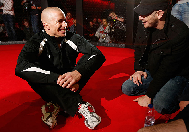 MONTREAL, CANADA - NOVEMBER 15:  Georges St-Pierre sits in the Octagon during an open training session ahead of UFC 154 at New City Gas on November 15, 2012 in Montreal, Quebec, Canada.  (Photo by Josh Hedges/Zuffa LLC/Zuffa LLC via Getty Images)