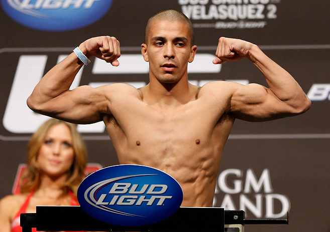 LAS VEGAS, NV - DECEMBER 28: John Moraga flexes during the UFC 155 weigh-in on December 28, 2012 at MGM Grand Garden Arena in Las Vegas, Nevada. (Photo by Josh Hedges/Zuffa LLC/Zuffa LLC via Getty Images)