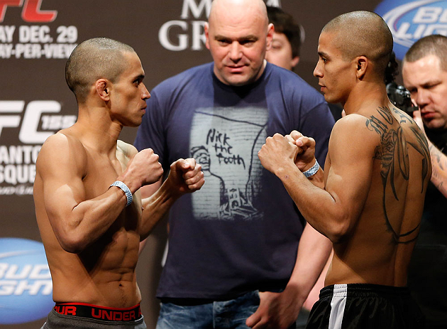 LAS VEGAS, NV - DECEMBER 28: (L-R) Opponents Chris Cariaso and John Moraga face off during the UFC 155 weigh-in on December 28, 2012 at MGM Grand Garden Arena in Las Vegas, Nevada. (Photo by Josh Hedges/Zuffa LLC/Zuffa LLC via Getty Images)