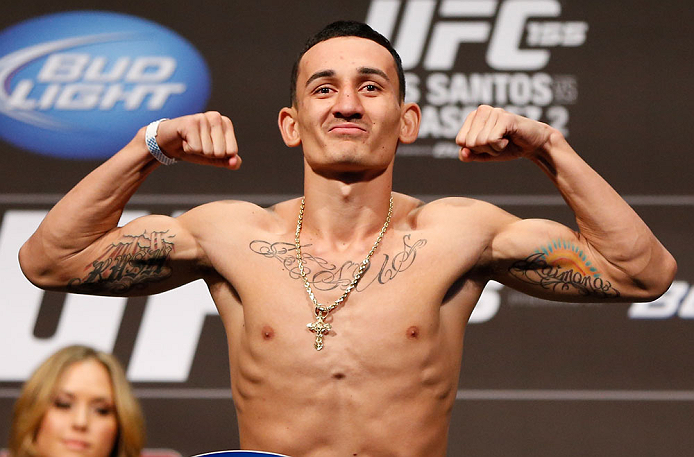 LAS VEGAS, NV - DECEMBER 28: Max Holloway flexes during the UFC 155 weigh-in on December 28, 2012 at MGM Grand Garden Arena in Las Vegas, Nevada. (Photo by Josh Hedges/Zuffa LLC/Zuffa LLC via Getty Images)