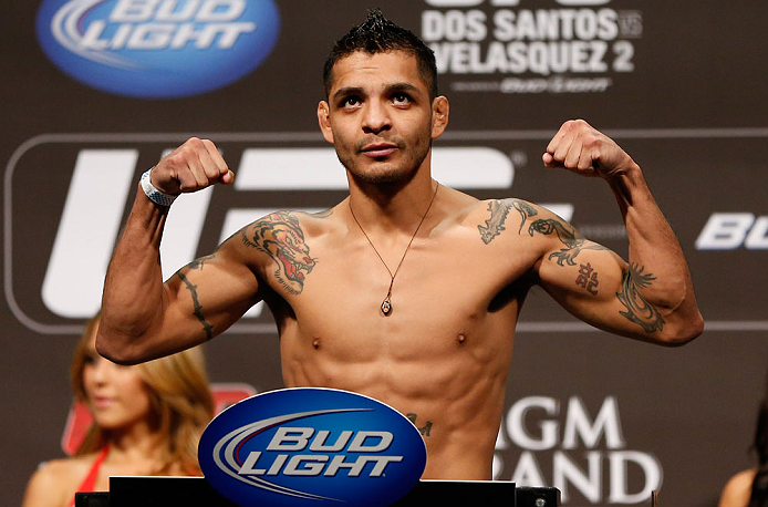 LAS VEGAS, NV - DECEMBER 28: Leonard Garcia flexes during the UFC 155 weigh-in on December 28, 2012 at MGM Grand Garden Arena in Las Vegas, Nevada. (Photo by Josh Hedges/Zuffa LLC/Zuffa LLC via Getty Images)