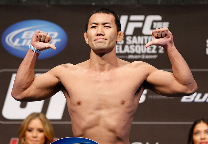 LAS VEGAS, NV - DECEMBER 28: Yushin Okami flexes during the UFC 155 weigh-in on December 28, 2012 at MGM Grand Garden Arena in Las Vegas, Nevada. (Photo by Josh Hedges/Zuffa LLC/Zuffa LLC via Getty Images)