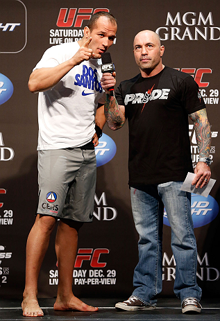 LAS VEGAS, NV - DECEMBER 28: (L-R) UFC Heavyweight Champion Junior dos Santos is interviewed by Joe Rogan during the UFC 155 weigh-in on December 28, 2012 at MGM Grand Garden Arena in Las Vegas, Nevada. (Photo by Josh Hedges/Zuffa LLC/Zuffa LLC via Getty Images)