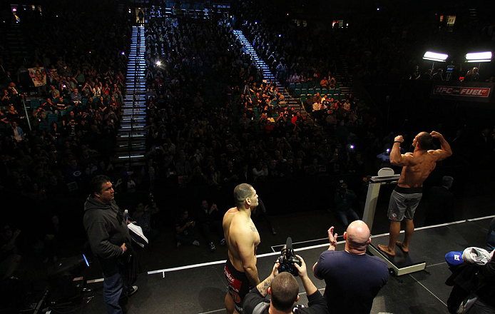 LAS VEGAS, NV - DECEMBER 28: UFC Heavyweight Champion Junior dos Santos (R) weighs in during the UFC 155 weigh-in on December 28, 2012 at MGM Grand Garden Arena in Las Vegas, Nevada. (Photo by Josh Hedges/Zuffa LLC/Zuffa LLC via Getty Images)