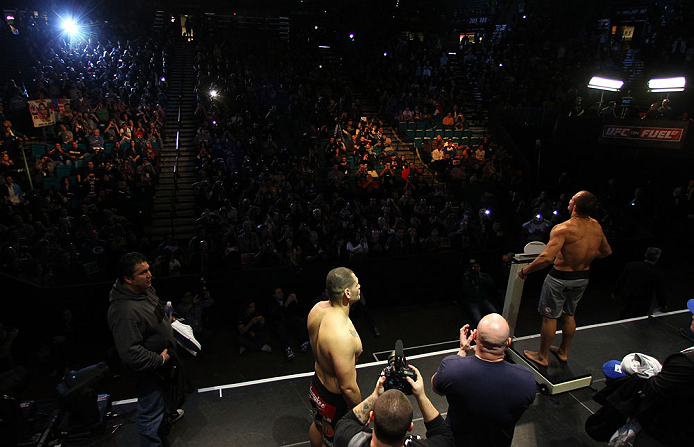 LAS VEGAS, NV - DECEMBER 28: UFC Heavyweight Champion Junior dos Santos (R) weighs in during the UFC 155 weigh-in on December 28, 2012 at MGM Grand Garden Arena in Las Vegas, Nevada. (Photo by Josh Hedges/Zuffa LLC/Zuffa LLC via Getty Images)
