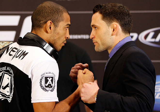 LAS VEGAS, NV - JANUARY 31:  (L-R) Opponents Jose Aldo and Frankie Edgar face off during the UFC 156 Ultimate Media Day on January 31, 2013 at the Mandalay Bay in Las Vegas, Nevada.  (Photo by Josh Hedges/Zuffa LLC/Zuffa LLC via Getty Images)