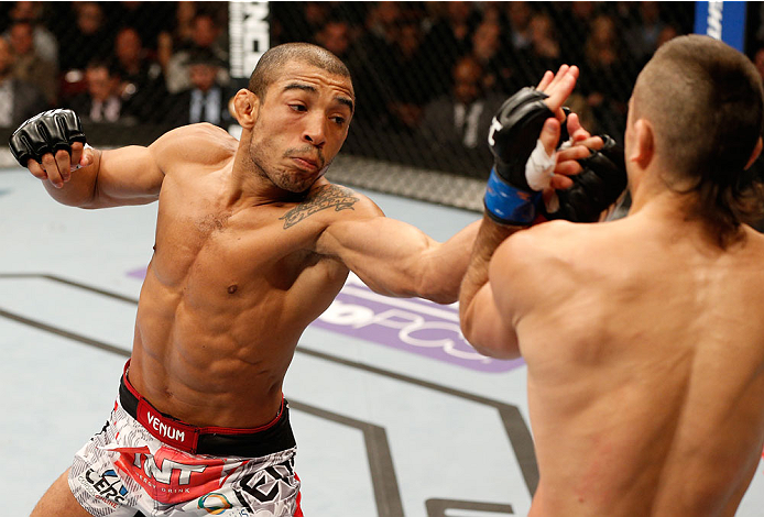 NEWARK, NJ - FEBRUARY 01:  (L-R) Jose Aldo punches Ricardo Lamas in their featherweight championship fight at the UFC 169 event inside the Prudential Center on February 1, 2014 in Newark, New Jersey. (Photo by Josh Hedges/Zuffa LLC/Zuffa LLC via Getty Images)