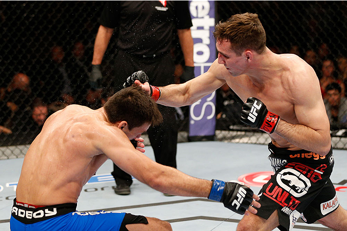 LAS VEGAS, NV - FEBRUARY 22:  (R-L) Rory MacDonald punches Demian Maia in their welterweight bout during UFC 170 inside the Mandalay Bay Events Center on February 22, 2014 in Las Vegas, Nevada. (Photo by Josh Hedges/Zuffa LLC/Zuffa LLC via Getty Images) *** Local Caption *** Rory MacDonald; Demian Maia